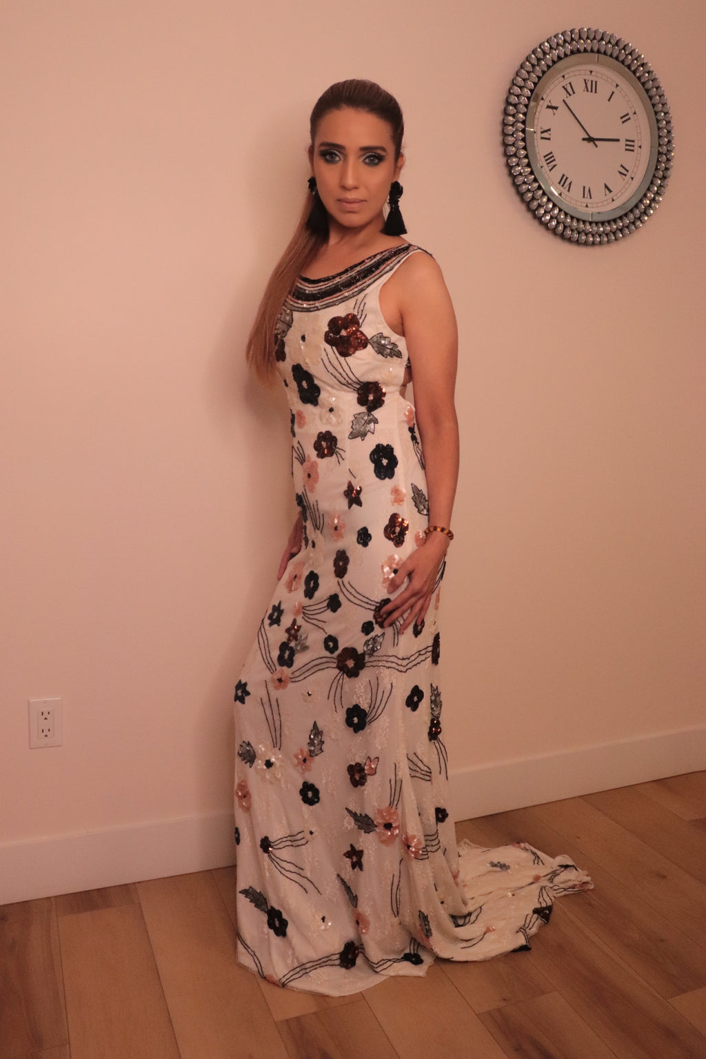 Long white backless dress with sequenced florals