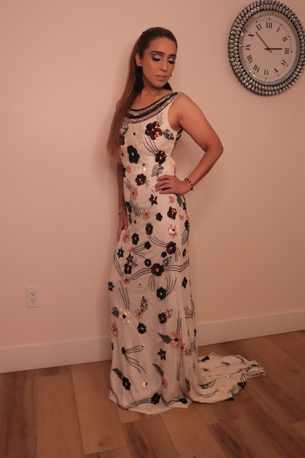 Long white backless dress with sequenced florals